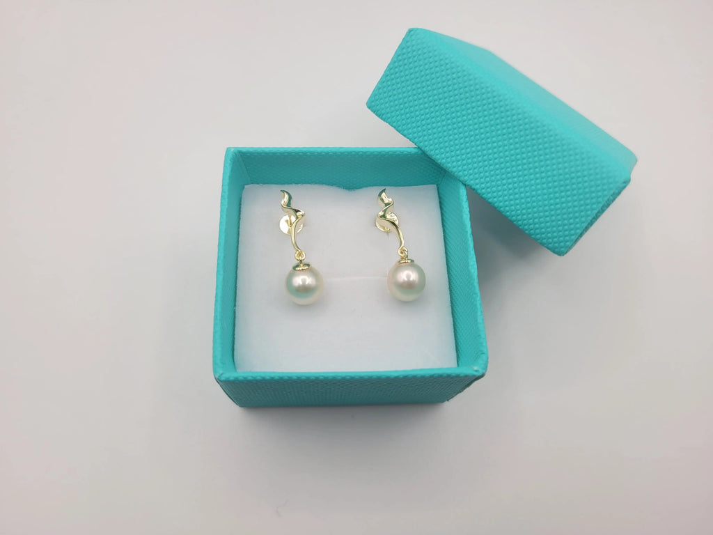 Akoya cultured pearl earrings 8-8.5mm on model — .925 sterling silver
