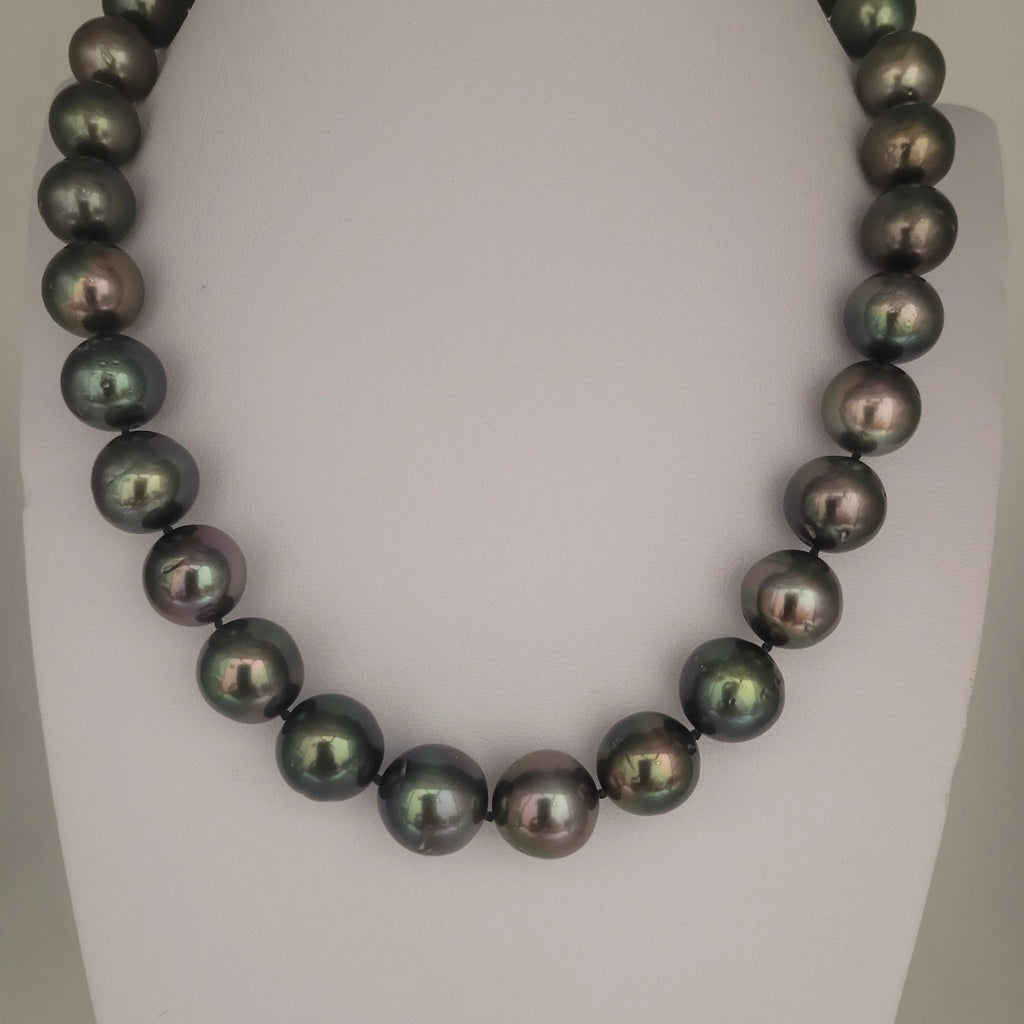 Tahitian cultured pearl 11-13mm luster close-up — round, very high luster